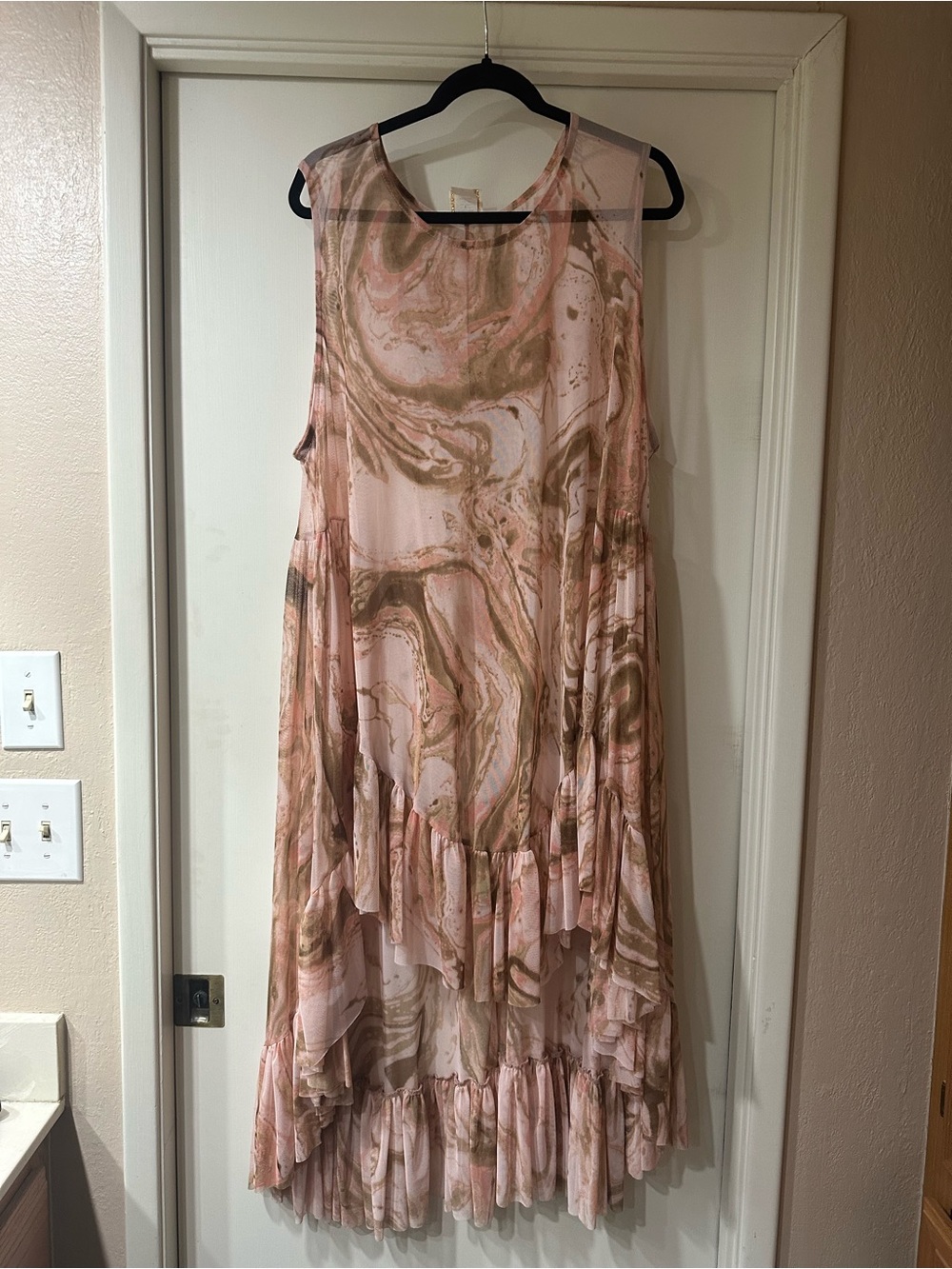Zadie B’s Pink Marble-Print Overlay. Pink layering dress sold separately.